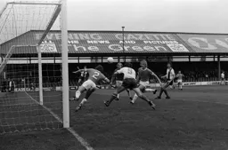 Peter Spiring first to the ball