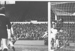 Roy Burton in the Oxford goal tips another effort over the bar