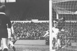 Roy Burton in the Oxford goal tips another effort over the bar
