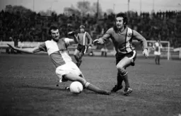 Jimmy Husband avoids the tackle