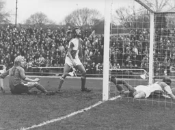 Ron Futcher watches as his header goes over the bar