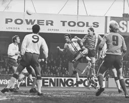 John Faulkner powers in a header