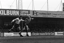 Ron Futcher in a heading duel with Chris Lawler
