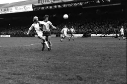 Ron Futcher battles with Duncan Forbes