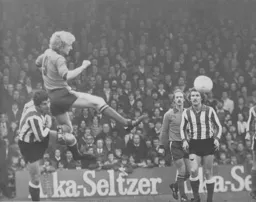 Ron Futcher heads the ball on