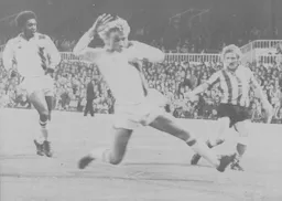 Paul Price attempts to block a cross