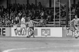 Alan West passing down the wing to John Aston