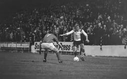 Steve Buckley takes on Charlton defender