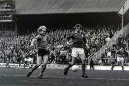 Ron Futcher tries to get to the ball first