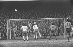 John Faulkner clears in front of the Oak Road End