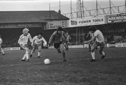 Brian Chambers runs past the Blackpool defence
