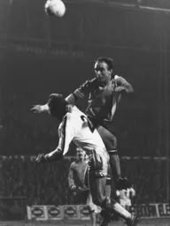 John Aston heads for goal