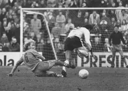 Paul Futcher puts in a sliding tackle