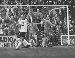 John Faulkner appeals for a foul on the goalkeeper