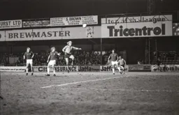 Ron Futcher gets high to send the ball towards goal