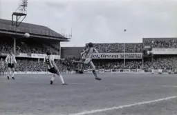 Graham Jones heads back across the box