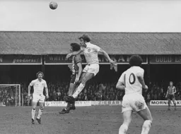 Brian Chambers is beaten in the air by Bolton's Sam Allardyce