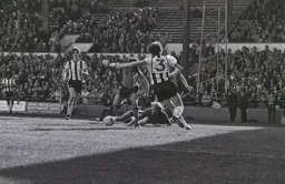 Phil Boersma rounds the keeper to slot home Town’s second.