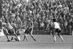 Paul Price watches Ron Futcher tackle the great George Best