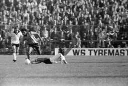 Rick Hill skips past George Best