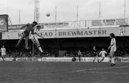Ricky Hill rises to head towards goal