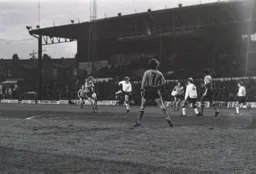 Alan West tries to beat Burnley defence from a long way out