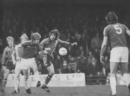 Alan West tries to lay the ball off