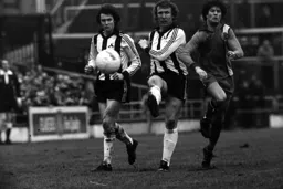 Phil Boersma battles with two County players