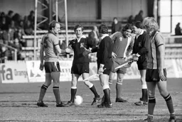 Captain John Faulkner shakes with the officials