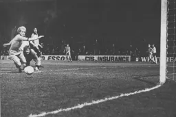 Ron Futcher slips with the goal at his mercy