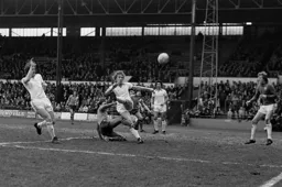 Blackpool defender slices a clearance
