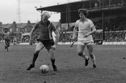 Ron Futcher taking on a defender