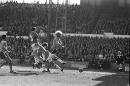 Ron Futcher stopped by three defenders