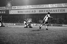 Alan West gets a crunching tackle in