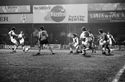 Mal Donaghy watches on as Rovers defence try to clear the ball