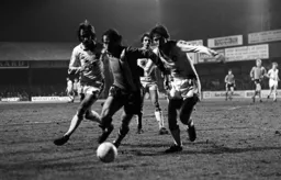 Bob Hatton holds off three defenders