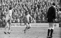 Chris Turner clears the defence