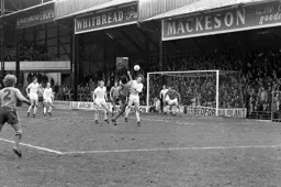 Ricky Hill battles for the ball in front of the Oak Road End