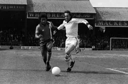 Ricky Hill takes on Fulham defender