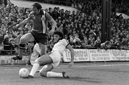 Bob Hatton hurdling the defenders tackle