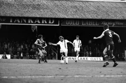 Tony Grealish plays through midfield