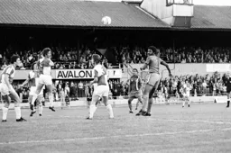 Ricky Hill looks to get his head to the ball