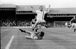 Tony Grealish hurdles the keeper