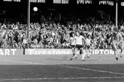 Mike Saxby loops in a header