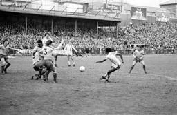 Ricky Hill shoots at the wall