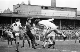 Bob Hatton dives for a header