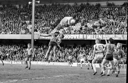 Ricky Hill competes for the ball and guides it into the Rangers net