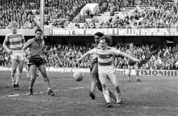 Ricky Hill first to the ball