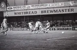 Steve White drives for goal