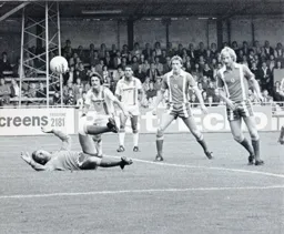 Everyone watches as the ball drifts wide